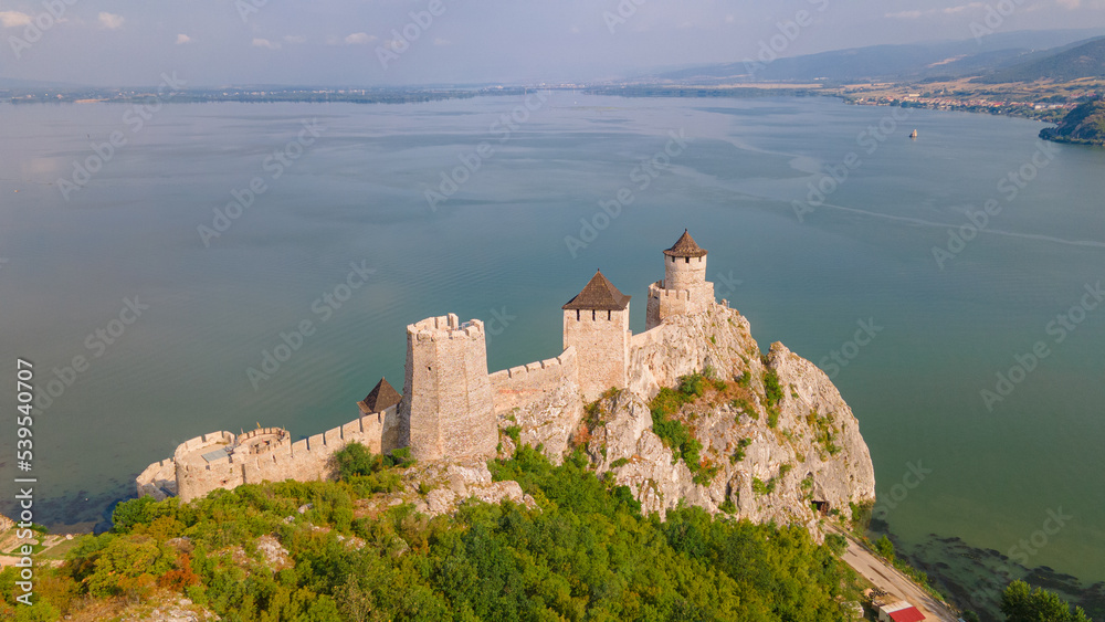 Aerial photography of Golubac fortress located on the Serbian side of the Danube river. Photography was shot from a drone with the Danube river in the background.