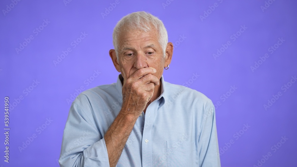 Elderly senior handsome man thinking and then getting a good idea, isolated on a purple solid background. Elderly senior handsome man thinking and then getting a good idea, isolated on a purple solid background.