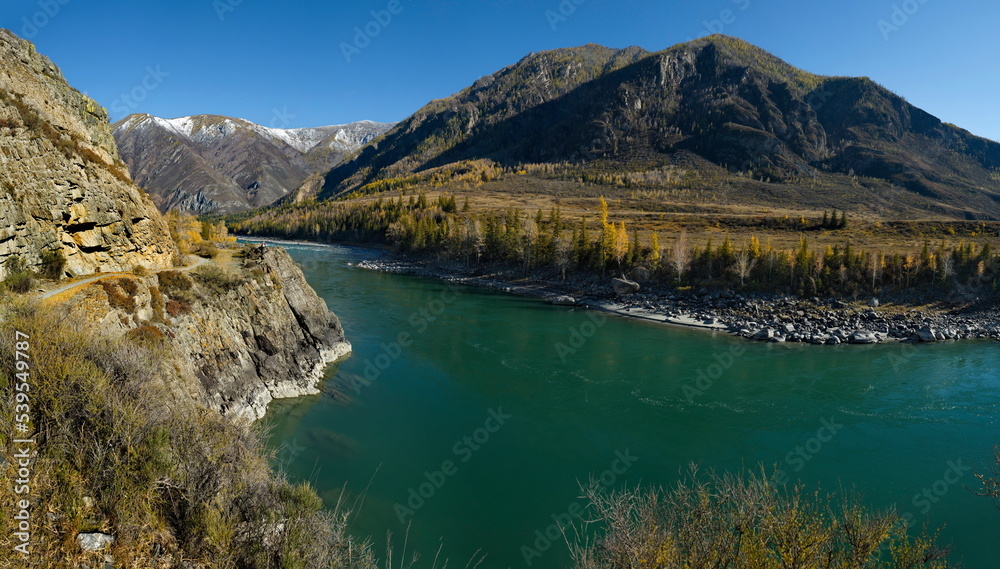 Russia. South of Western Siberia, the Altai Mountains. Picturesque high-altitude view in autumn colors of the Katun River near the village of Inegen.