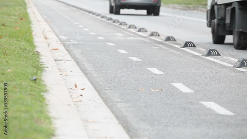 red bicycles and electric scooter riding on bike lane in the center of Barcelona, sustainability, urban mobility, low emissions, climate change