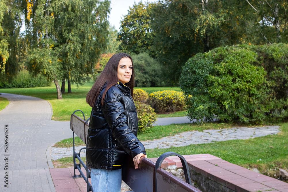 Girl on the bridge in the autumn park Girl on the bridge in the autumn park