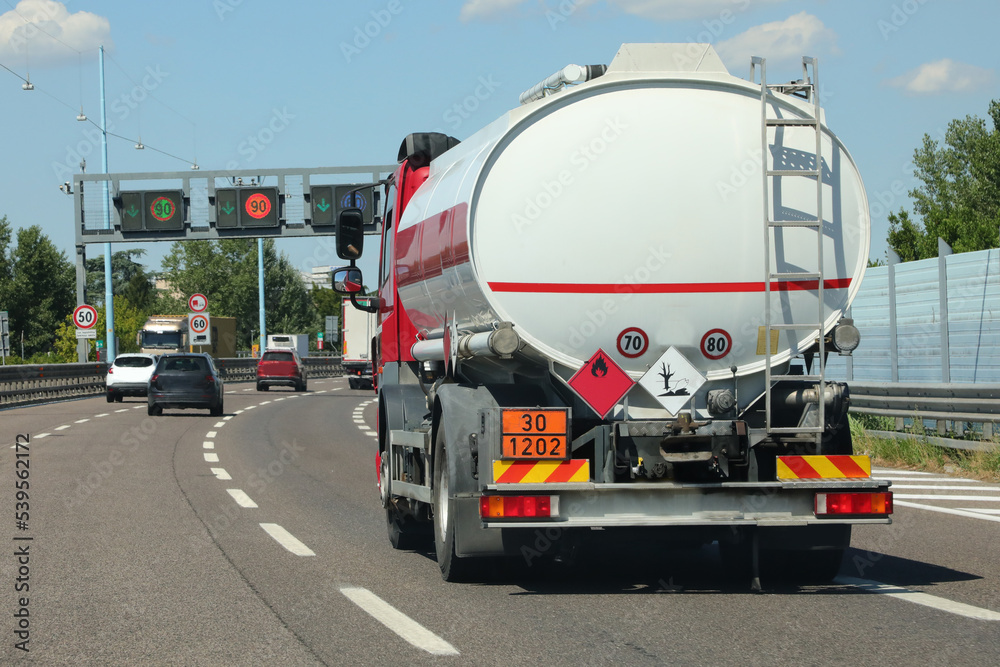 tanker truck runs fast carrying fossil fuel on the road
