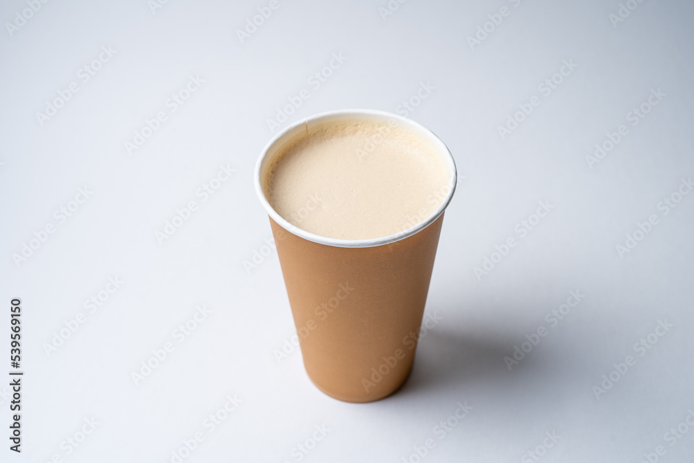 coffee with soy milk in a disposable cardboard craft cup coffee with soy milk in a disposable cardboard craft cup
