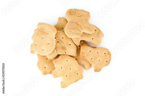 Cookies in the form of animals on a white background. Heap of delicious crispy zoological biscuits. Full depth of field.