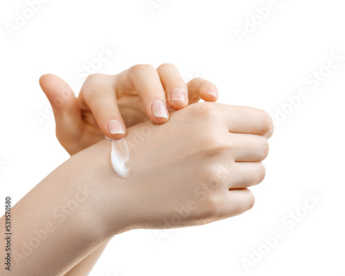 Woman applying hand cream  for hands. photo