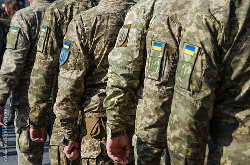 Ukrainian soldiers on military parade. Ukrainian flag on military uniform. Ukraine troops.