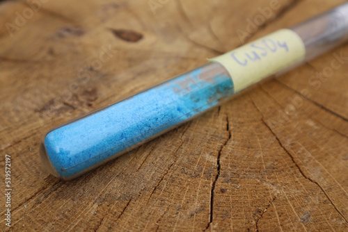 Popular in the chemical industry, a crystalline substance in a test tube is blue copper sulfate. It's widely used in industry as a fungicide, as a reagent for obtaining other copper compounds.