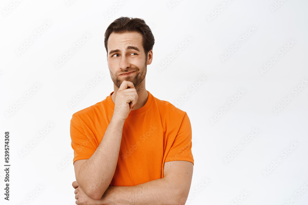 Thinking man in orange tshirt Thinking man in orange tshirt