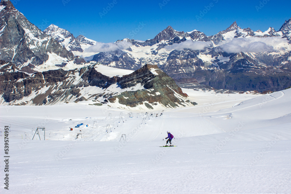 one teenage girl skiing in the swiss alps during summer, Zermatt Switzerland