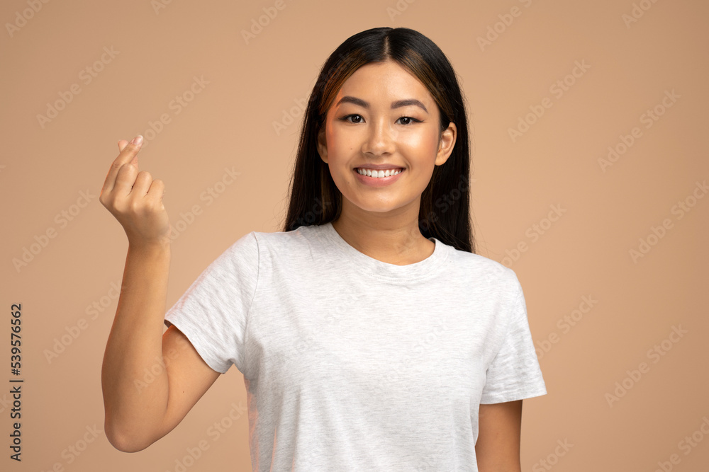 Portrait of beautiful stylish girl smiling and making money gesture, asking for payment Portrait of beautiful stylish girl smiling and making money gesture, asking for payment