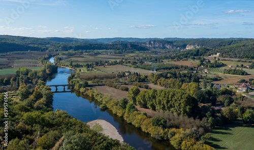 view along the Dordogne river and scenic countryside from high in the Castelnaud-la-Chapelle Chateau, blue sky