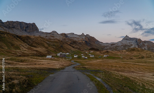empty road in the Swiss alps early in the morning in Tannalp photo