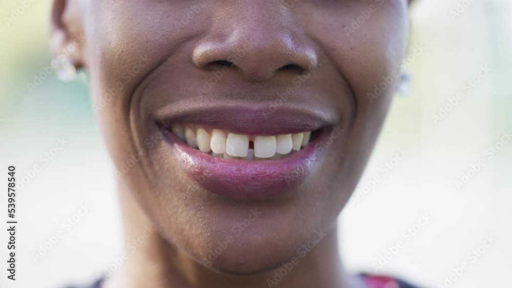 Close up of black females mouth talking to camera 
