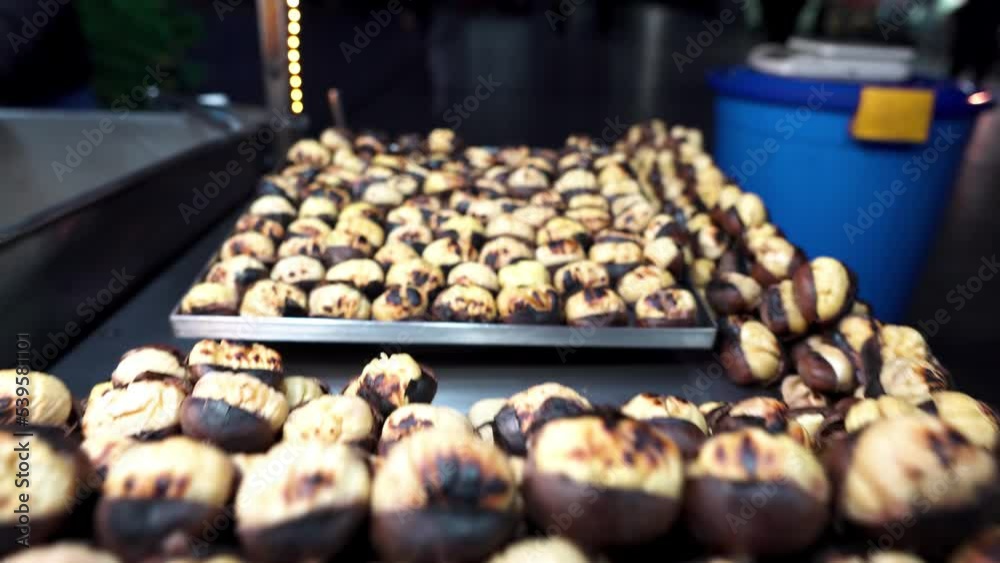 Street food in Istanbul. Turks sell street food in the center of Istanbul. Turks roast chestnuts. Turkish food. Nightlife in Istanbul. Night Istanbul. Roasted chestnuts on the counter Street food in Istanbul. Turks sell street food in the center of Istanbul. Turks roast chestnuts. Turkish food. Nightlife in Istanbul. Night Istanbul. Roasted chestnuts on the counter