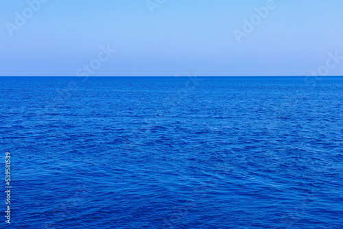 View of the open sea from the yacht. Background with selective focus