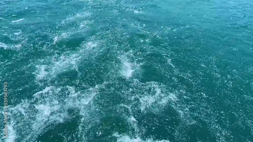 Splashes on the water slow motion view, footprint on the water after the yacht or boat closeup concept, splashing on the water in the ocean or sea, movement on the water Splashes on the water slow motion view, footprint on the water after the yacht or boat closeup concept, splashing on the water in the ocean or sea, movement on the water