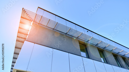 Abstract fragment of contemporary architecture, walls made of glass and concrete. Office building. #539583711