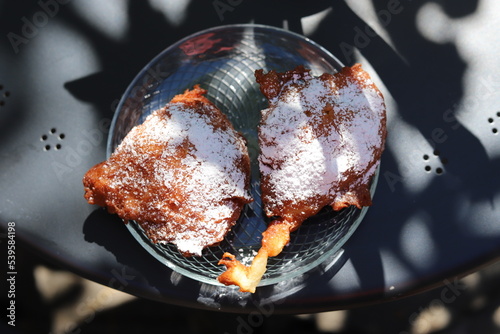 Fényképezés Ruchanki - traditional dessert baked from bread dough, hot fried on fat, topped