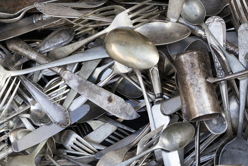 set of old silver cutlery piled up