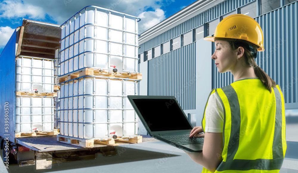 Woman dispatcher of transport company. Girl with laptop near truck. Dispatcher controlled shipment of plastic containers. Woman and logistics building. Transport company dispatcher in reflective vest - obrazy, fototapety, plakaty 