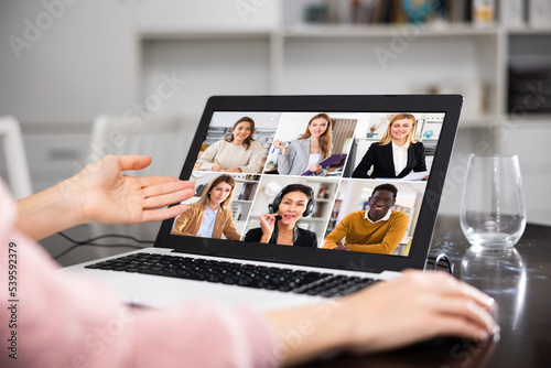 Young woman holding a video conference online on the internet