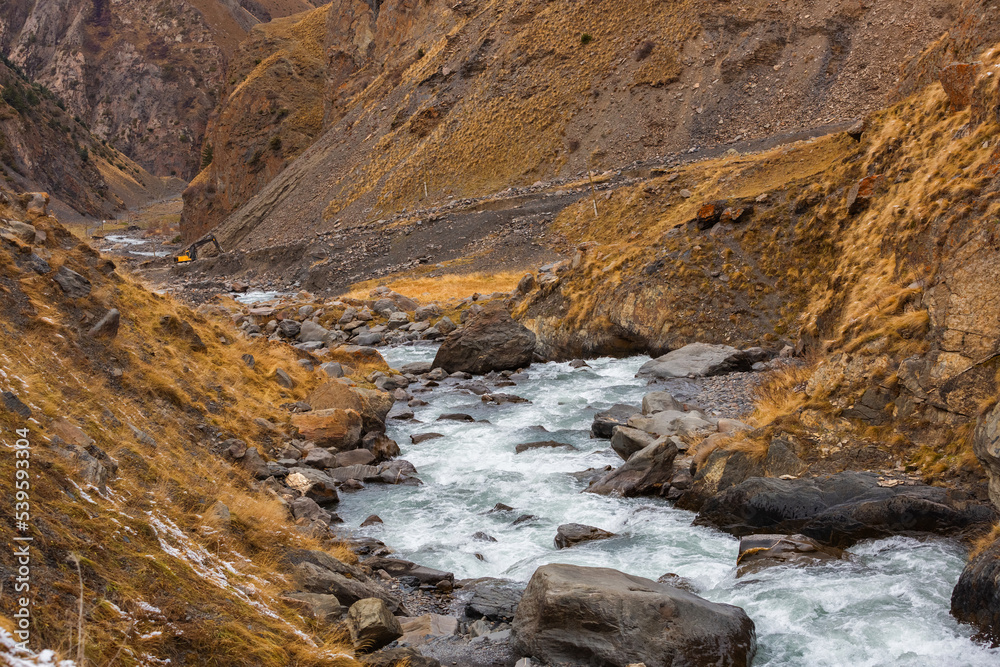 Beautiful panoramic view of the gorge. Autumn mountain landscape. Oysor river in Dagestan, Russia. Valley in Chirkhalyu or Chvakhilo waterfalls. Majestic mountain peaks. Beautiful panoramic view of the gorge. Autumn mountain landscape. Oysor river in Dagestan, Russia. Valley in Chirkhalyu or Chvakhilo waterfalls. Majestic mountain peaks.