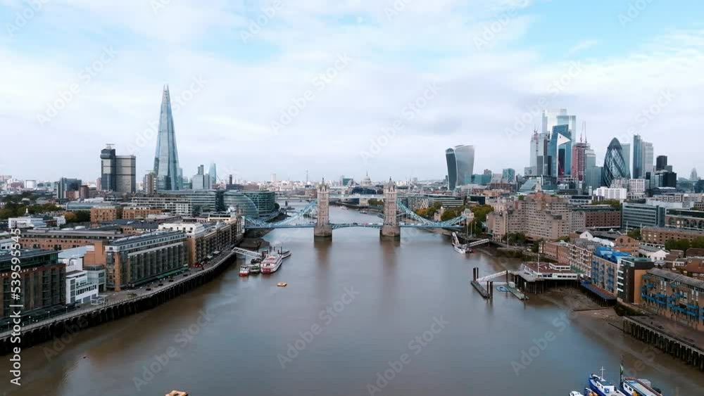 Iconic Tower Bridge connecting London with Southwark on the Thames River. Aerial view of London city center and the Tower bridge the symbol of London. Iconic Tower Bridge connecting London with Southwark on the Thames River. Aerial view of London city center and the Tower bridge the symbol of London.