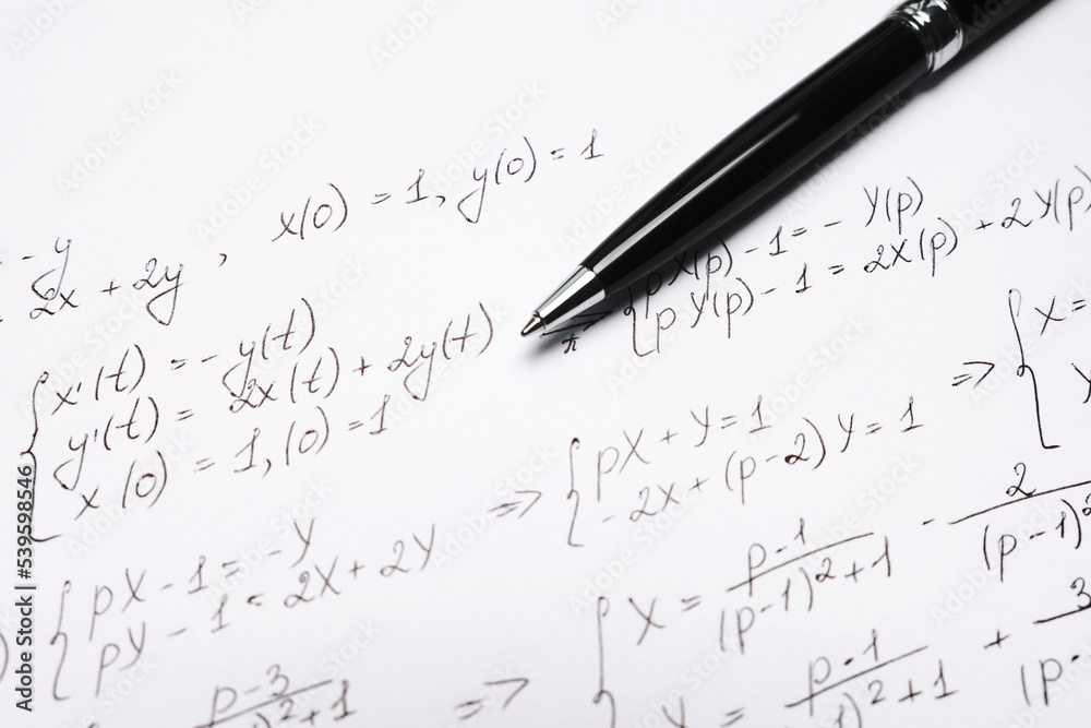 Sheet of paper with mathematical formulas and pen, closeup Sheet of paper with mathematical formulas and pen, closeup
