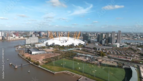 Aerial bird's eye view of iconic concert Hall of O2 Arena in North Greenwich Peninsula in London. Beautiful city of London from above. photo