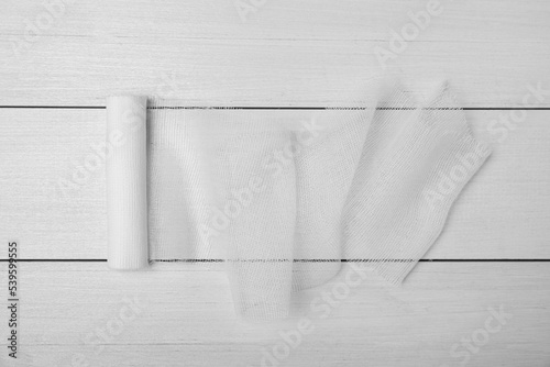 Medical bandage on white wooden table, top view © New Africa