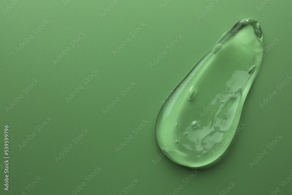 Sample of gel on green background, top view. Space for text Sample of gel on green background, top view. Space for text