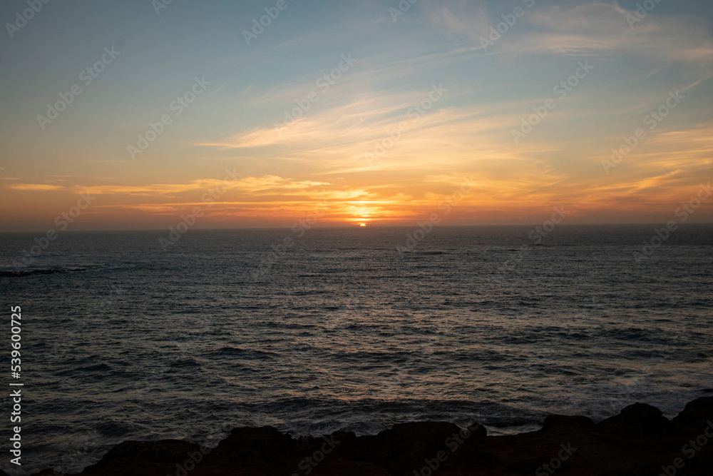 Sun setting over the Oregon Coastline at Devil's Punchbowl Natural Area. Sun setting over the Oregon Coastline at Devil's Punchbowl Natural Area.