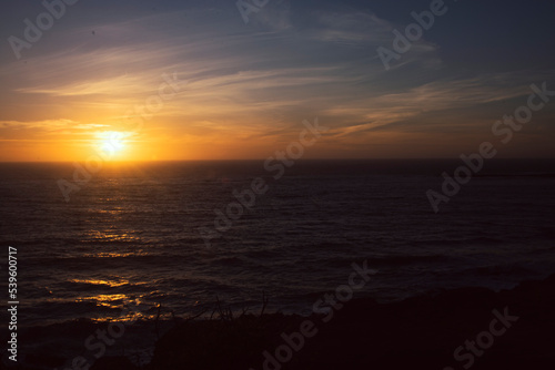 Sun setting over the Oregon Coastline at Devil s Punchbowl Natural Area.  