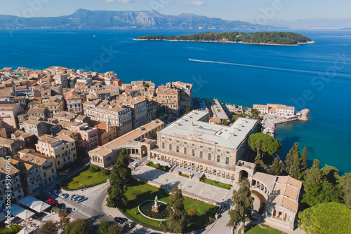 Kerkyra city, Corfu island, Greece, beautiful summer aerial drone view of Kerkyra old town center, with Ionean sea harbour port, Saint Spyridon Church, the Royal Palace and scenery beyond the city