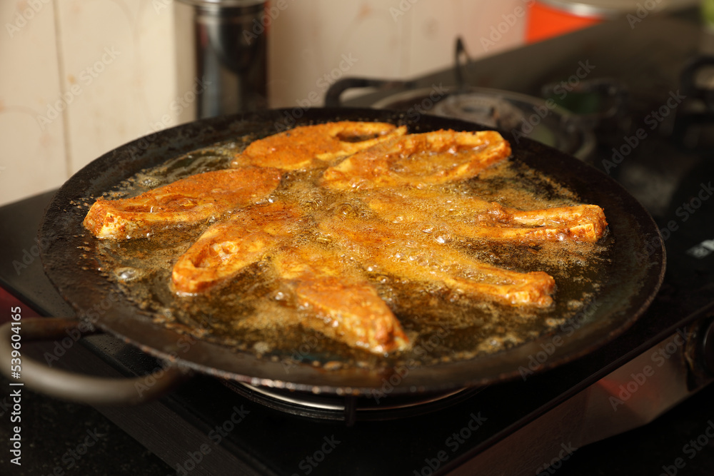 Spicy Fish is frying in oil