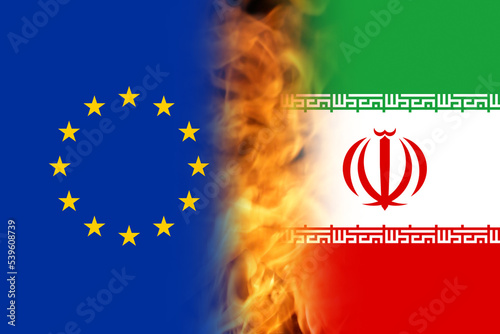 Defocus Iran sanctions concept. Iranian flag, concept on the topic of sanctions in Iran. War between Iran and EU, Europe. Fire, flame. Out of focus photo