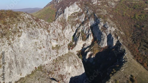 Stone rocks of the Nisevac near Svrljig in Serbia cliff and gorge rock on the mountain range in sunny day Aerial drone video over the hill photo