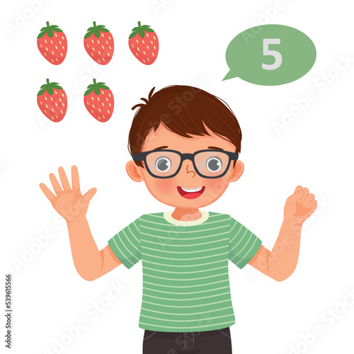 Cute little boy counting with finger showing number five with hand gesture