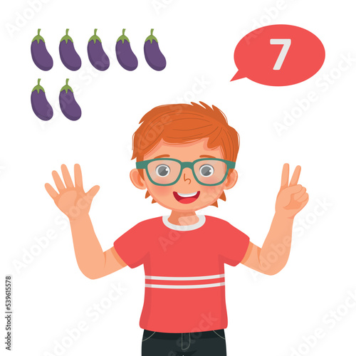 Cute little boy counting with finger showing number seven with hand gesture