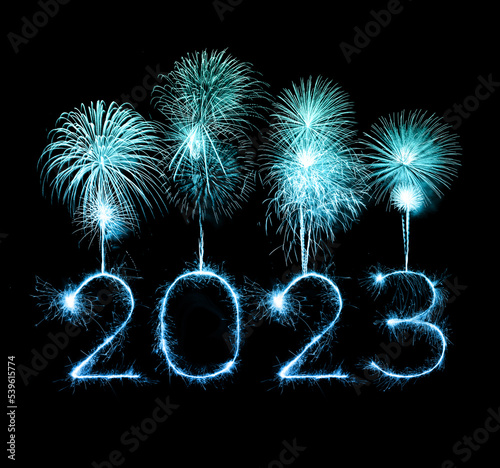 2023 happy new year fireworks celebration written sparkling at night.