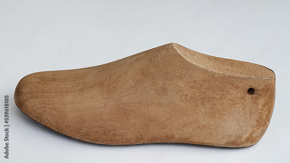 Old wooden shoe shape used by shoemakers in the manufacture of adult and children's shoes. Modeling. Old wooden shoe shape used by shoemakers in the manufacture of adult and children's shoes. Modeling.