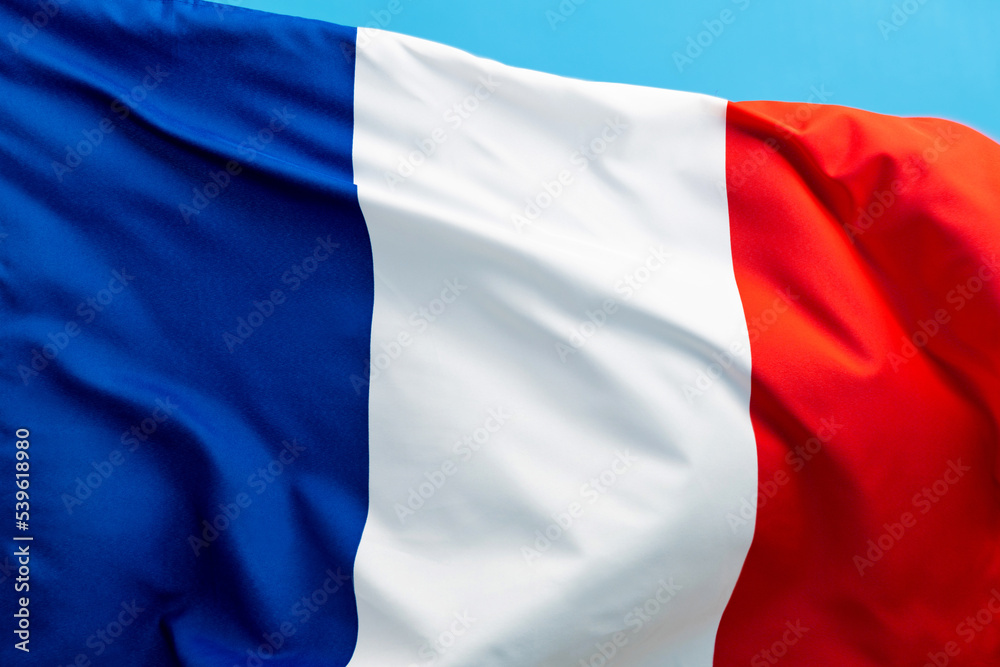French flag waving on blue background