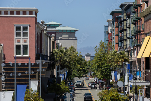 Daytime view of traffic passing through downtown Emeryville, California, USA. photo