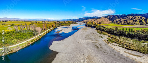 Panorama aerial drone landscape image of Wairau River in the Marlborough Region of the South Island of New Zealand on a sunny summer day photo