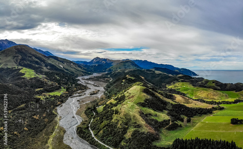 An aerial panoramic landscape photo of Puhi Puhi river and Mangamaunu Bay on the Pacific ocean shore on the South Island of New Zealand photo