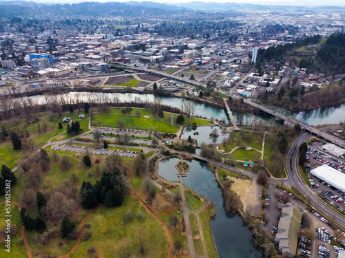 An aerial view of Alton baker park and the Willamette River with a lake 