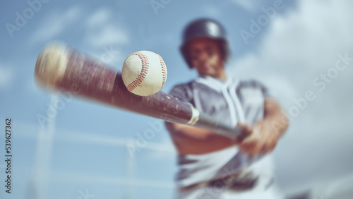 Baseball, baseball player and bat ball swing at a baseball field during training, fitness and game practice. Softball, swinging and power hit with athletic guy focus on speed, performance and pitch