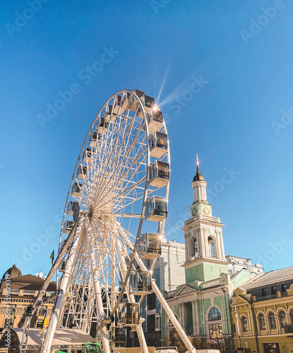 Ferris wheel on the square near the Orthodox church in Kyiv