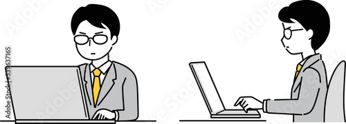 パソコンを操作する眼鏡のビジネスマン