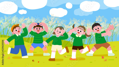 Happy children playing in the autumn meadow
